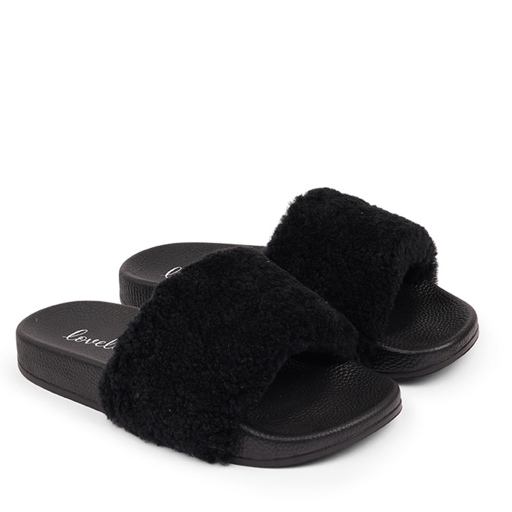 Lovelies Slides with Australian Shearling upper.  This wonderful slide has a soft and light rubber sole which makes it very comfortable and an all time favorite sandal. The 100% shearling wool will keep you warm or cool you down on hot summer days.