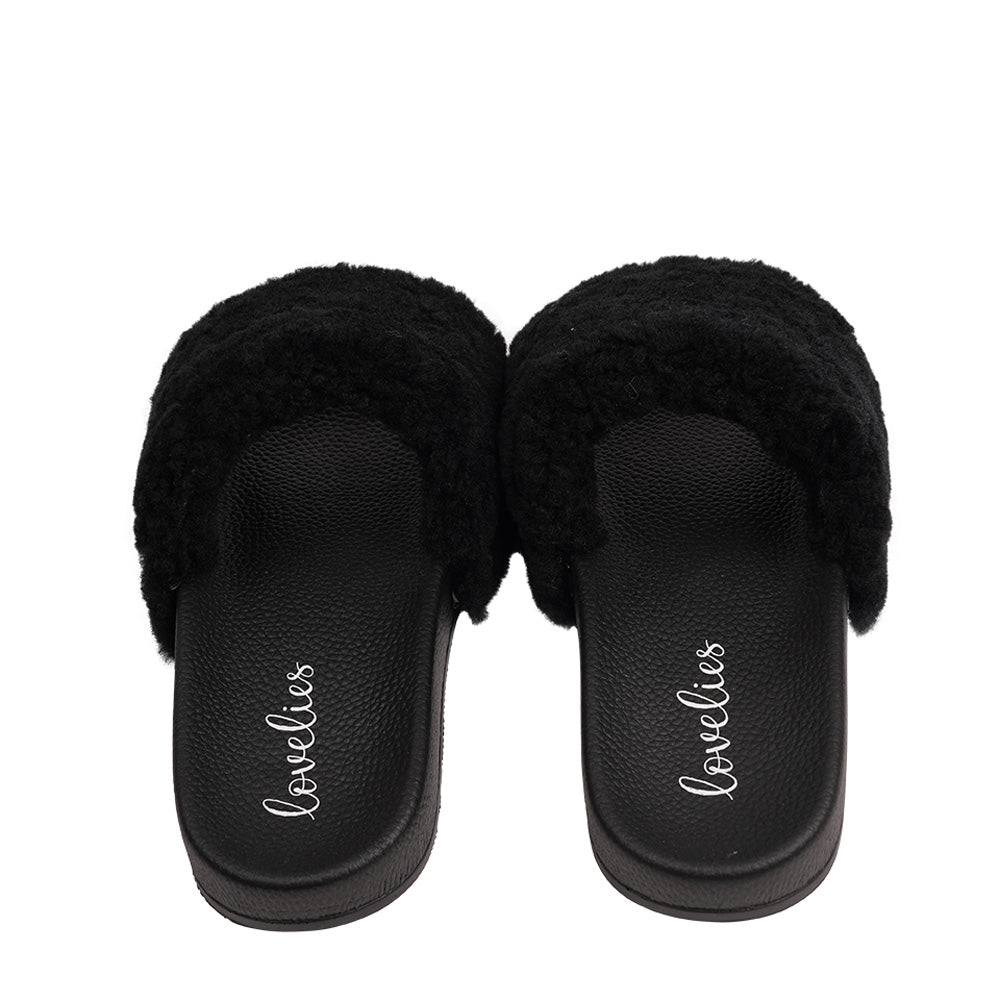 Slides with Australian Shearling upper. This wonderful slide has a soft and light rubber sole which makes it very comfortable and an all time favorite sandal. The 100% shearling wool will keep you warm or cool you down on hot summer days.