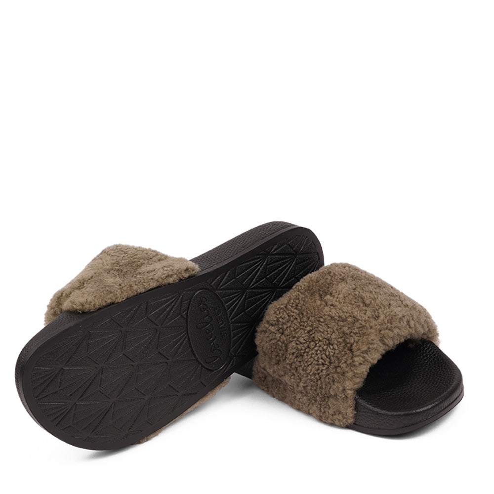 Slides with Australian Shearling upper.  This wonderful slide has a soft and light rubber sole which makes it very comfortable and an all time favorite sandal. The 100% shearling wool will keep you warm or cool you down on hot summer days.