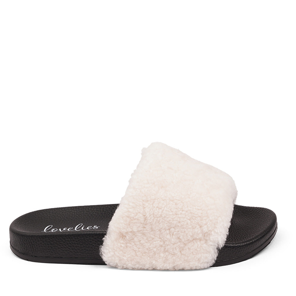 Slides with Australian Shearling upper. This wonderful slide has a soft and light rubber sole which makes it very comfortable and an all time favorite sandal. The 100% shearling wool will keep you warm or cool you down on hot summer days.