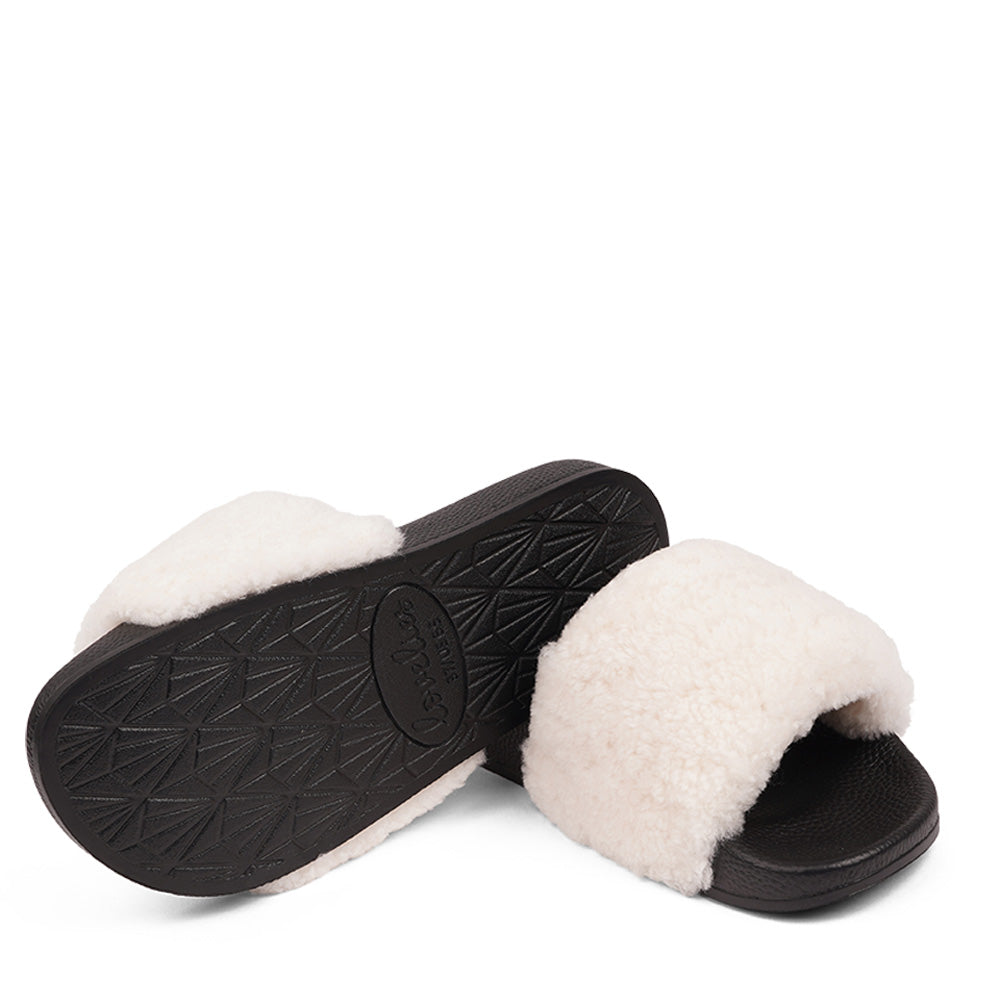 Slides with Australian Shearling upper.  This wonderful slide has a soft and light rubber sole which makes it very comfortable and an all time favorite sandal. The 100% shearling wool will keep you warm or cool you down on hot summer days.