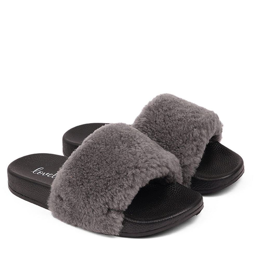 Slides with Australian Shearling upper.  This wonderful slide has a soft and light rubber sole which makes it very comfortable and an all time favorite sandal. The 100% shearling wool will keep you warm or cool you down on hot summer days.