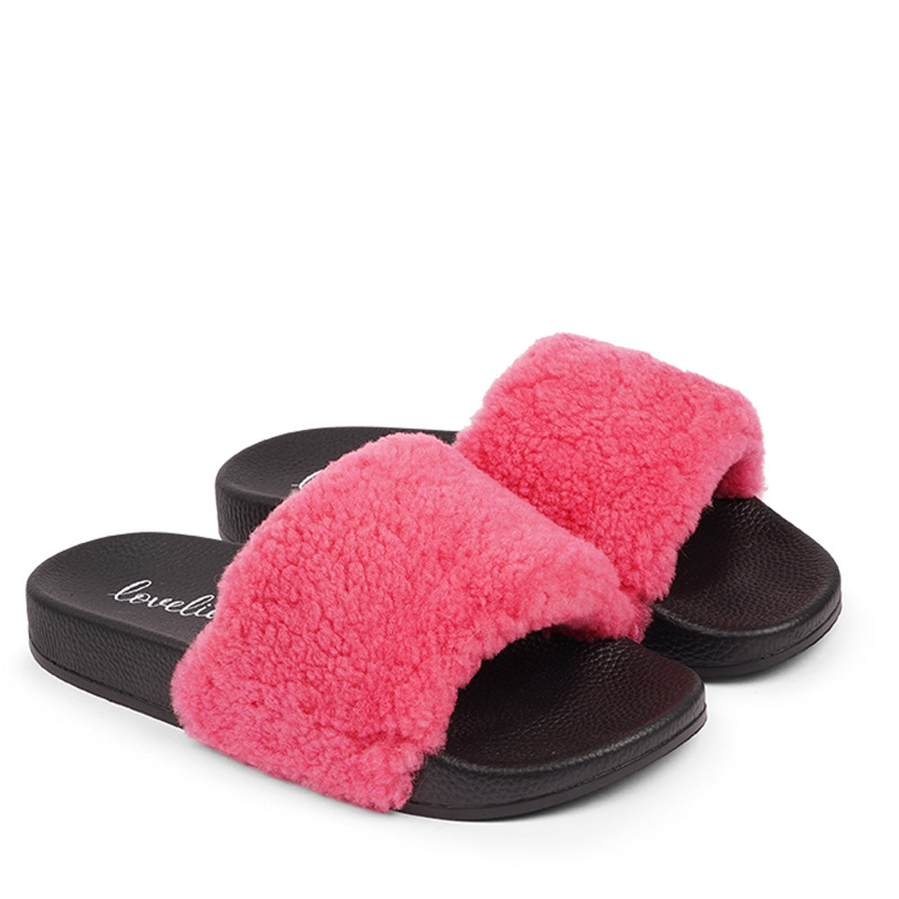 Slides with Australian Shearling upper.  This wonderful slide has a soft and light rubber sole which makes it very comfortable and an all time favorite sandal. The 100% shearling wool will keep you warm or cool you down on hot summer days.