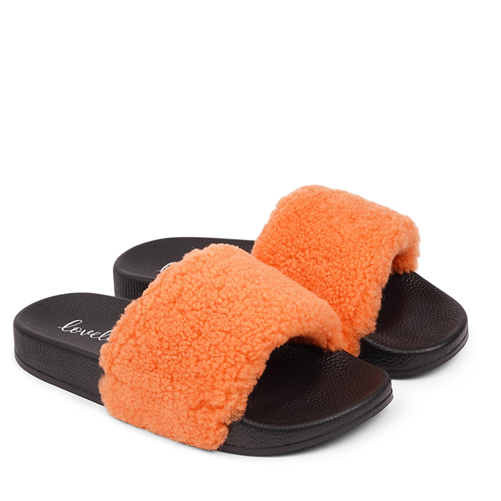 Slides with Australian Shearling upper.  This wonderful slide has a soft and light rubber sole which makes it very comfortable and an all time favorite sandal. The 100% shearling wool will keep you warm or cool you down on hot summer days.