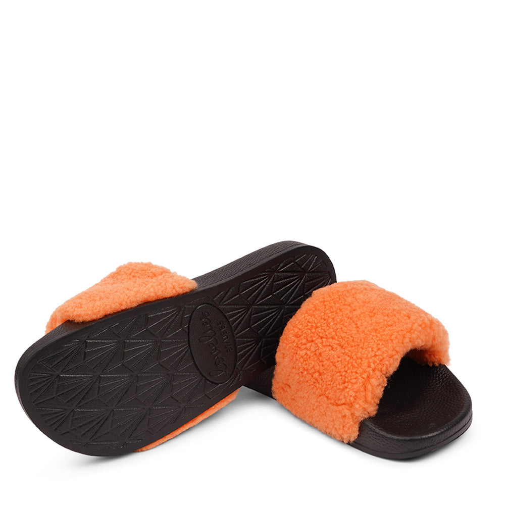 Slides with Australian Shearling upper.  This wonderful slide has a soft and light rubber sole which makes it very comfortable and an all time favorite sandal. The 100% shearling wool will keep you warm or cool you down on hot summer days.