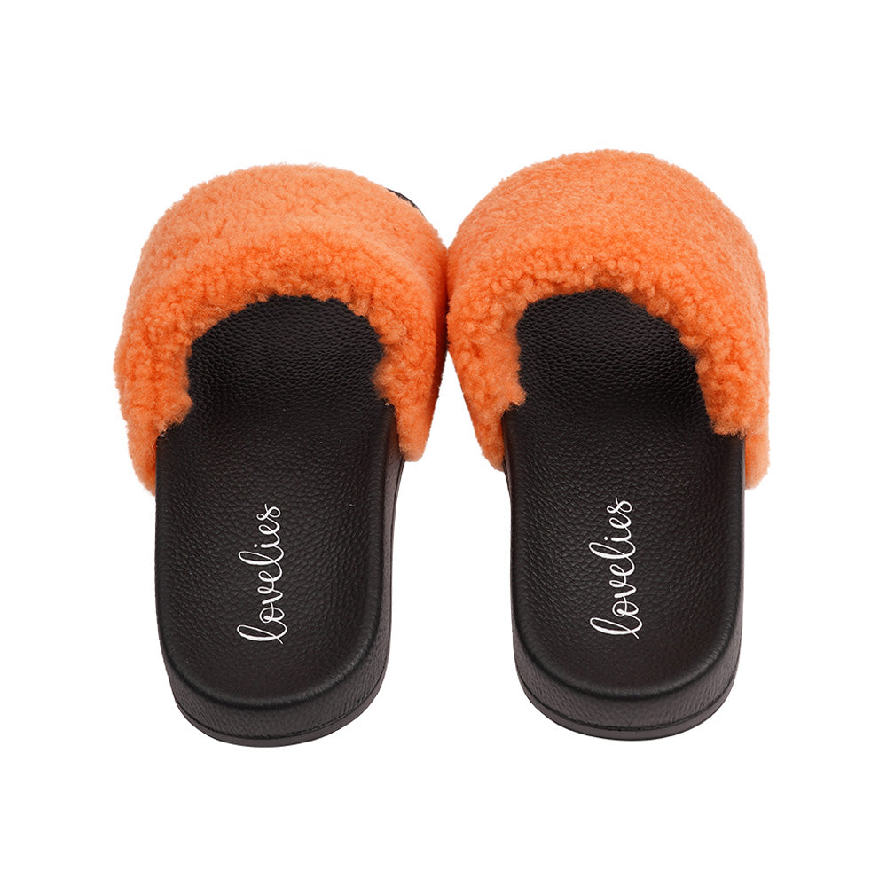 Slides with Australian Shearling upper. This wonderful slide has a soft and light rubber sole which makes it very comfortable and an all time favorite sandal. The 100% shearling wool will keep you warm or cool you down on hot summer days.