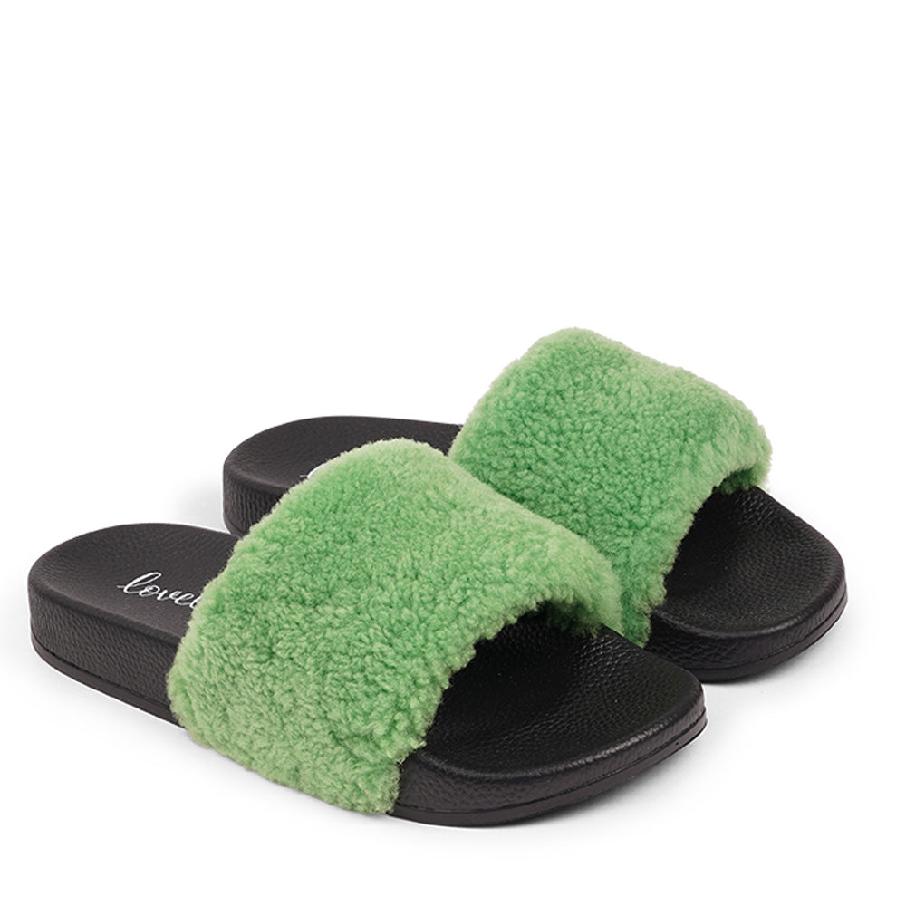 Slides with Australian Shearling upper.  This wonderful slide has a soft and light rubber sole which makes it very comfortable and an all time favorite sandal. The 100% shearling wool will keep you warm or cool you down on hot summer days.