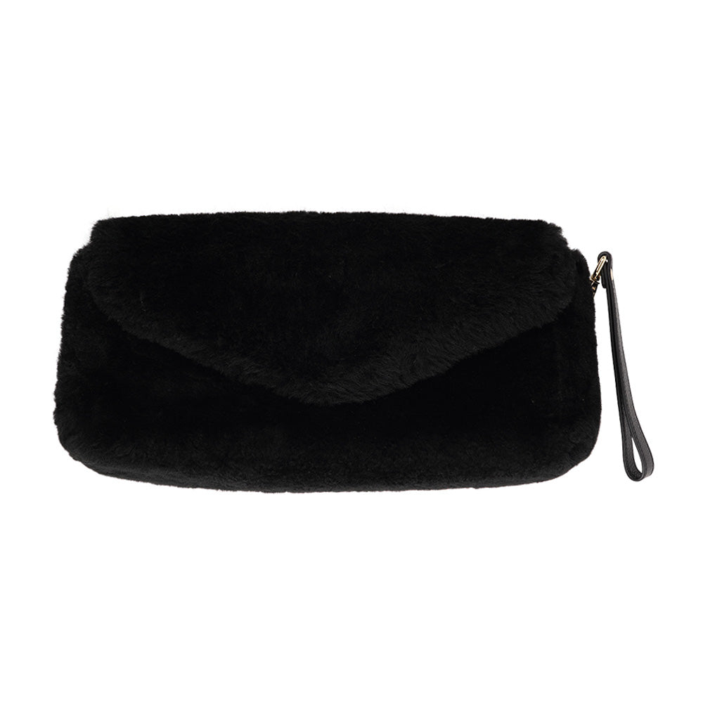 Understated and elegant, this Cona shearling clutch with detachable crossbody strap comes in both black and cream. Cona is perfect for carrying your essentials with you for party or everyday use.  Front flap with hidden magnetic fastening  Adjustable and detachable wrist strap  Adjustable and detachable shoulder strap in leather  Shoulder strap 105 cm and 15 mm wide  Lining of suede and soft skin