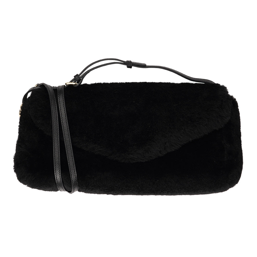 Understated and elegant, this Cona shearling clutch with detachable crossbody strap comes in both black and cream. Cona is perfect for carrying your essentials with you for party or everyday use.  Front flap with hidden magnetic fastening  Adjustable and detachable wrist strap  Adjustable and detachable shoulder strap in leather  Shoulder strap 105 cm and 15 mm wide  Lining of suede and soft skin
