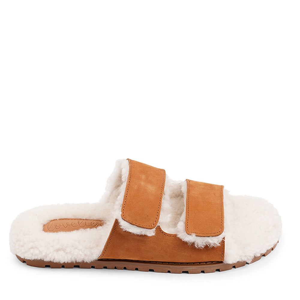 Lovelies Studio - Adjustable Nubuck sandals with shearling lining Lovelies shearling sandals will bring softness and warmth to your feet this autumn. The combination of soft shearling and rubber sole guarantees the utmost comfort to the wearer. Lovelies Studio is a Danish brand.