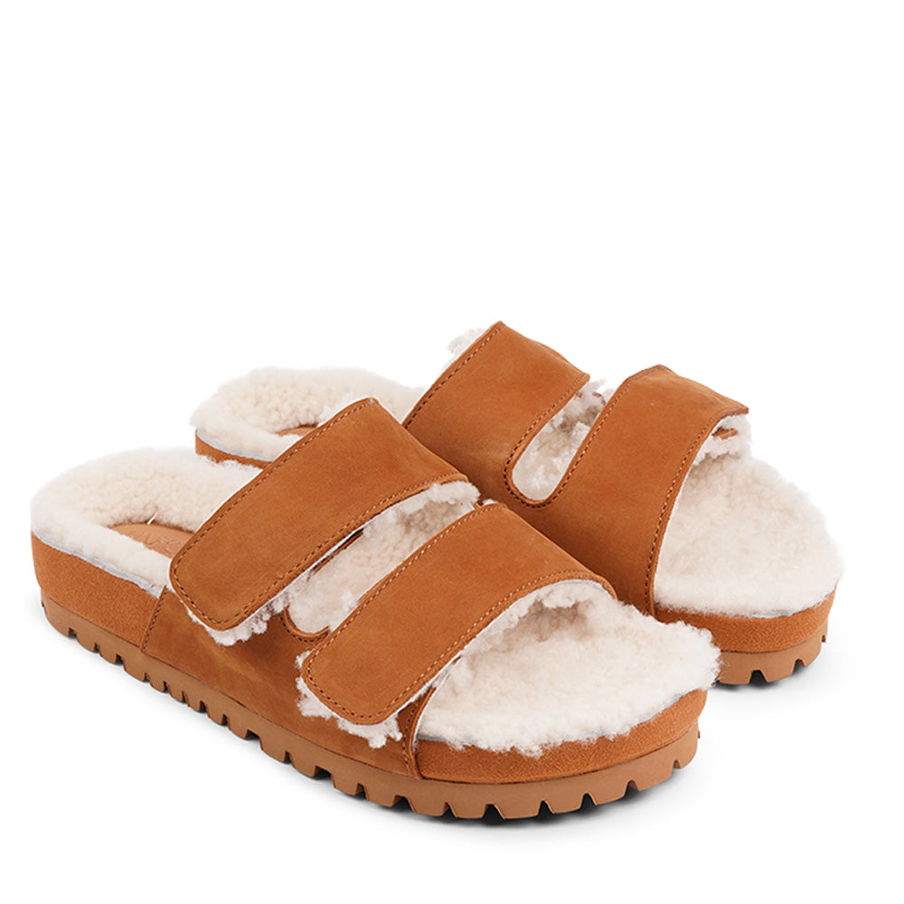 Lovelies Studio - Adjustable Nubuck sandals with shearling lining  Lovelies shearling sandals will bring softness and warmth to your feet this autumn. The combination of soft shearling and rubber sole guarantees the utmost comfort to the wearer. Lovelies Studio is a Danish brand.