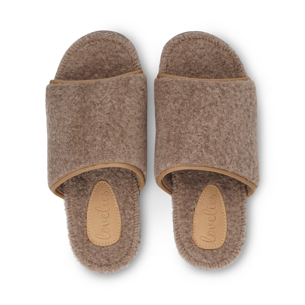 Lovelies studio - Soft and cosy lounge slippers Lovelies lounge slippers are the essence of comfortability. When you’re in the need of surrounding your feet in soft and warm slippers, Lovelies lounge slippers are the answer. With soft and durable soles, fine wool and a gorgeous design, you’ll never want to wear any other home-shoe to make you feel at ease.
