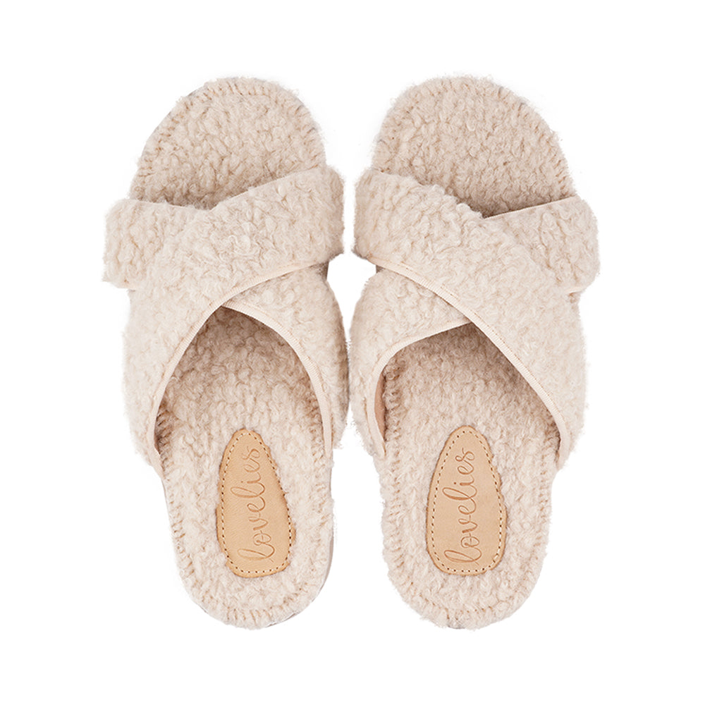 Lovelies lounge slippers are the essence of comfortability. When you’re in the need of surrounding your feet in soft and warm slippers, Lovelies lounge slippers are the answer. With soft and durable soles, fine wool and a gorgeous design, you’ll never want to wear any other home-shoe to make you feel at ease. Enjoy your Lovelies! See our Size Guide Material: Outsole / Insole : Rubber Footbed: Curly faux fur Lining: 80% Wool – 20% polyester Upper: Curly faux fur