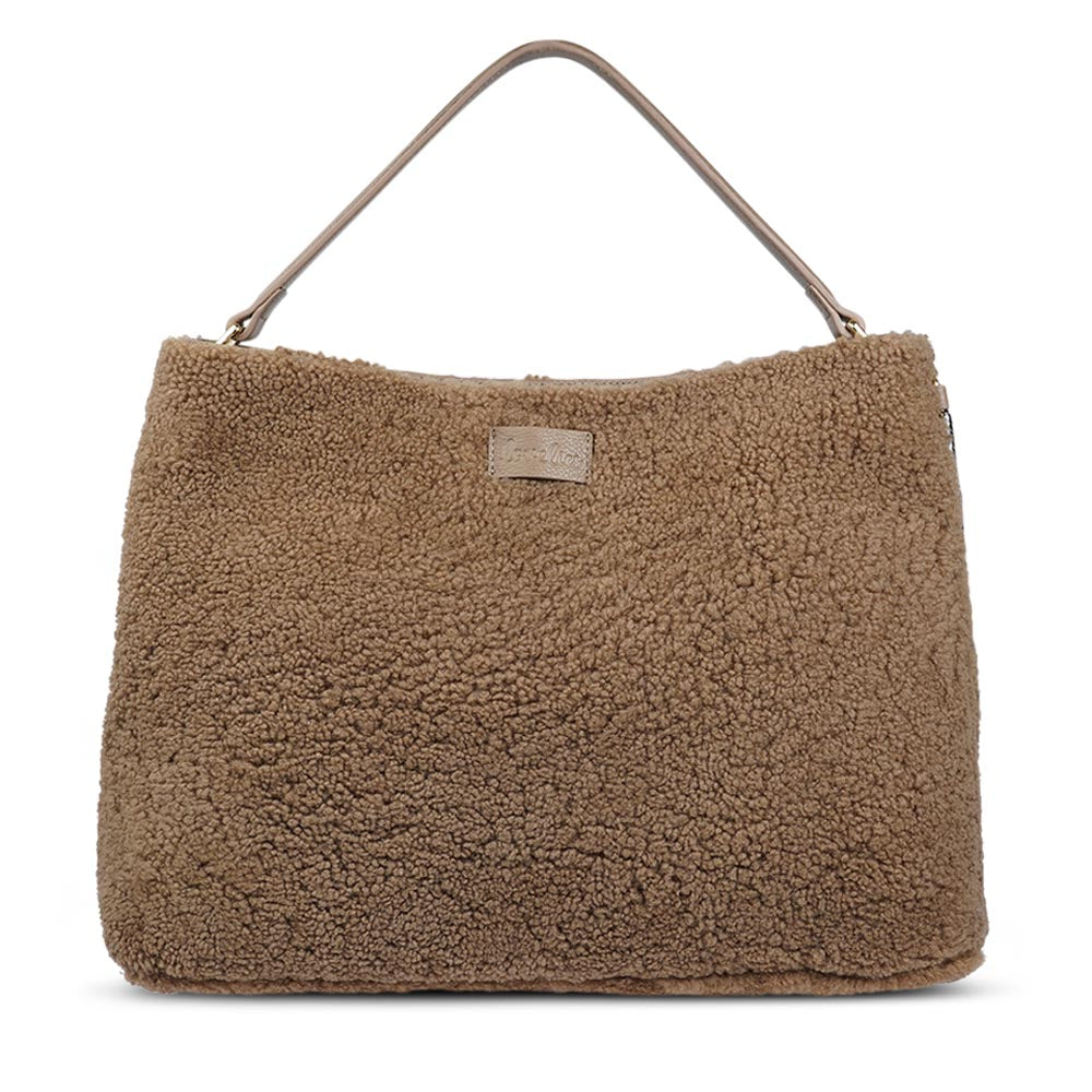 Mainling is a tribute to craftsmanship and the handmade, this large and very soft bag comes in curly shearling and with beautiful leather details. * Top double zipped closure. * Top handle in soft skin with hardware in gold. * Adjustable and detachable shoulder strap in leather, 15 mm wide. * Satin lining and flat zipped inner pocket * Item comes with a branded dust bag. * Embossed Lovelies logo on the front. * Gold-toned hardware * Messurements W40 X D10 X H30 cm * 100 % Australian shearling