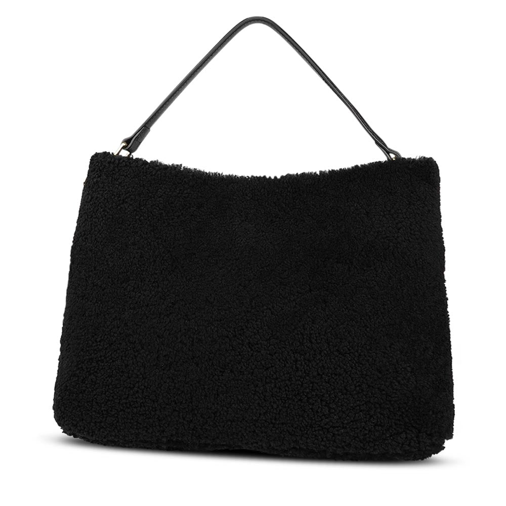 Mainling is a tribute to craftsmanship and the handmade, this large and very soft bag comes in curly shearling and with beautiful leather details. * Top double zipped closure. * Top handle in soft skin with hardware in gold. * Adjustable and detachable shoulder strap in leather, 15 mm wide. * Satin lining and flat zipped inner pocket * Item comes with a branded dust bag. * Embossed Lovelies logo on the front. * Gold-toned hardware * Messurements W40 X D10 X H30 cm * 100 % Australian shearling