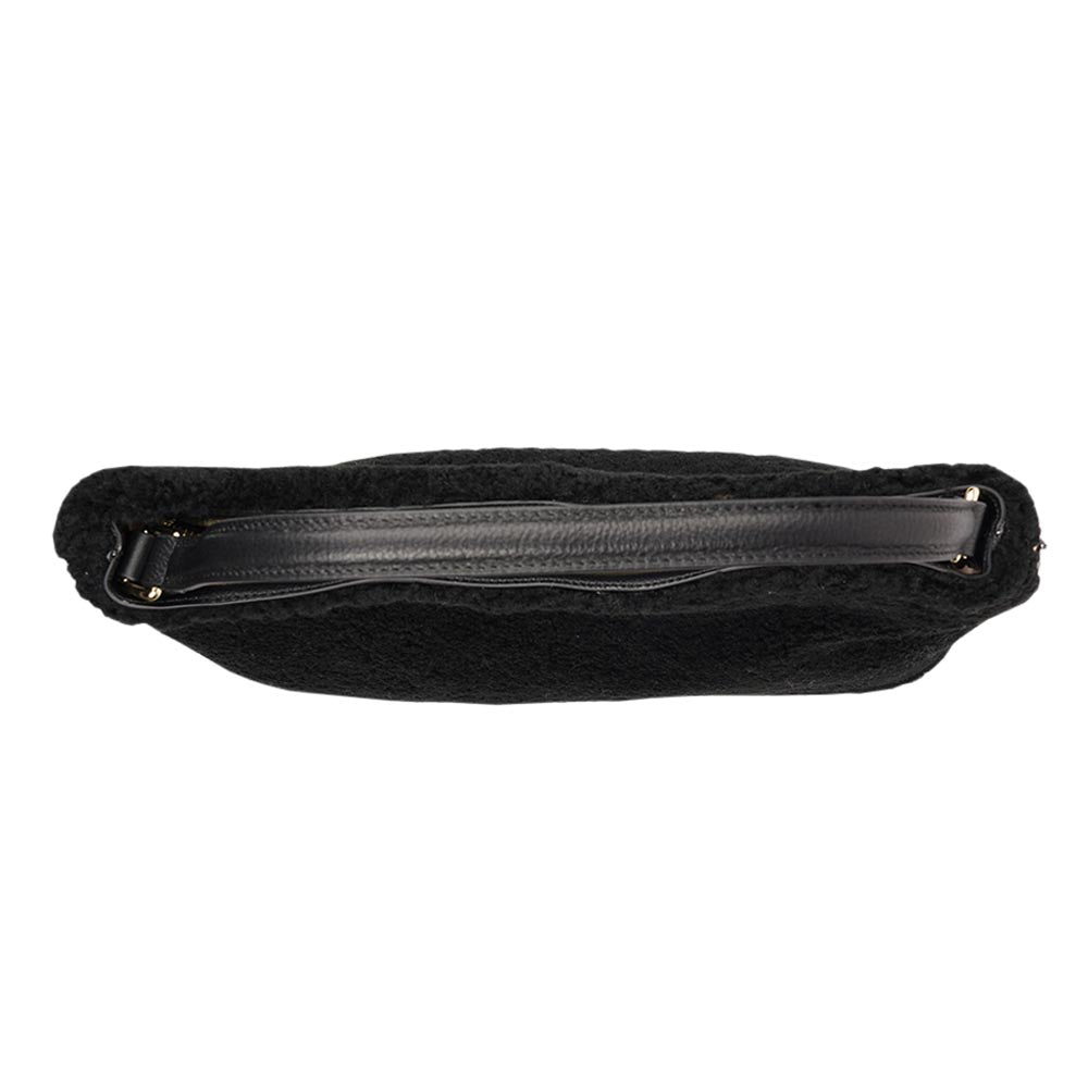 Mainling is a tribute to craftsmanship and the handmade, this large and very soft bag comes in curly shearling and with beautiful leather details. * Top double zipped closure. * Top handle in soft skin with hardware in gold. * Adjustable and detachable shoulder strap in leather, 15 mm wide. * Satin lining and flat zipped inner pocket * Item comes with a branded dust bag. * Embossed Lovelies logo on the front. * Gold-toned hardware * Messurements W40 X D10 X H30 cm * 100 % Australian shearling