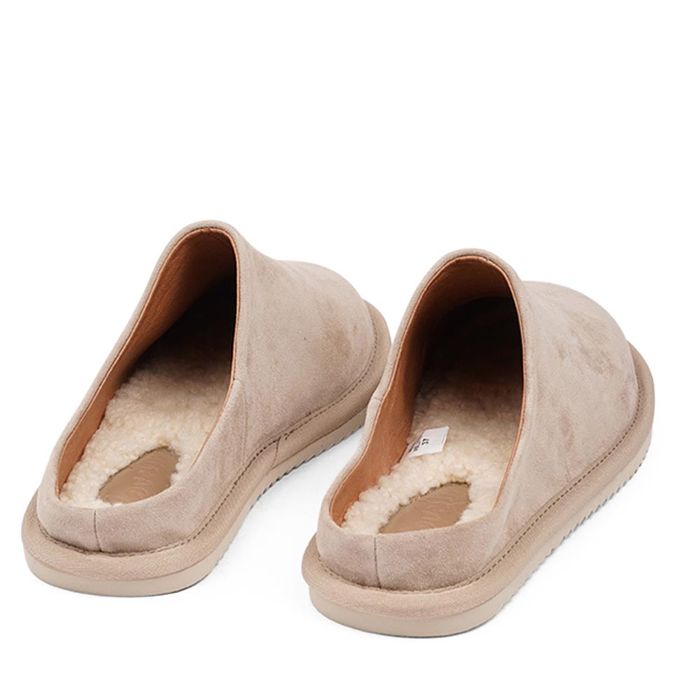 Lovelies calf suede mules will bring softness and warmth to your feet this summer. The combination of soft curly shearling and the durable rubber sole guarantees the utmost comfort to the wearer.  Size and fit:  True to size If you are between sizes, we recommend taking the next size up. Material:  Outsole / Insole : Rubber  Footbed: Shearling Lining:  Leather Upper: Calf suede LWG Environmental GOLD RATED Certification