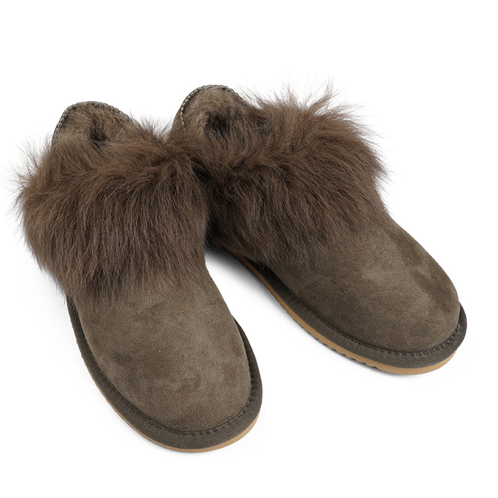 Soft and cosy shearling slippers with heel cap  Lovelies shearling slippers are the essence of comfortability. When you’re in the need of surrounding your feet in soft and warm slippers, Lovelies shearling slippers are the answer. With soft and durable soles, warm shearling and a gorgeous design, you’ll never want to wear any other home-shoe to make you feel at ease.