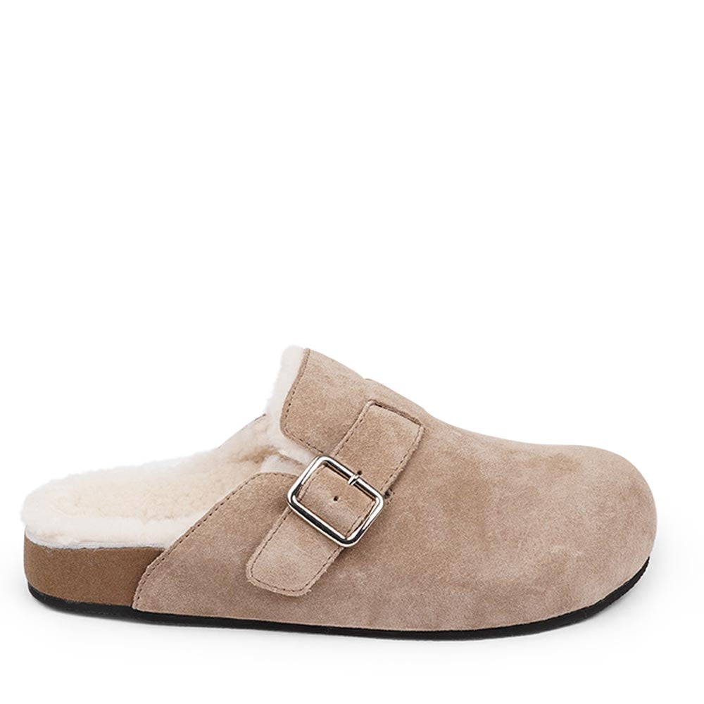 Suede Mules with adjustable buckle and curly shearling lining  Lovelies shearling mules will bring softness and warmth to your feet this summer. The combination of soft curly shearling and the durable rubber sole guarantees the utmost comfort to the wearer. Nesso Mules in Taupe from Danish Lovelies Studio.