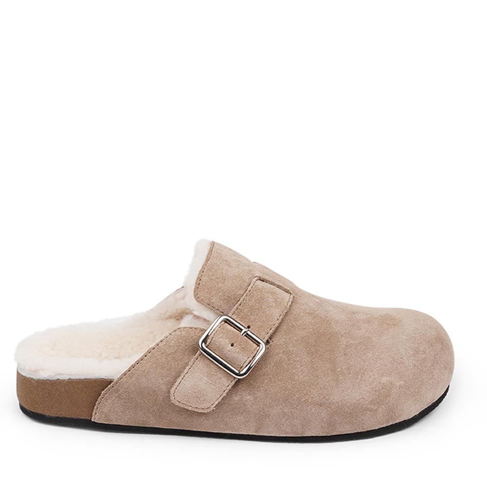 Suede Mules with adjustable buckle and curly shearling lining Lovelies shearling mules will bring softness and warmth to your feet this summer. The combination of soft curly shearling and the durable rubber sole guarantees the utmost comfort to the wearer. Nesso Mules in Taupe from Danish Lovelies Studio.
