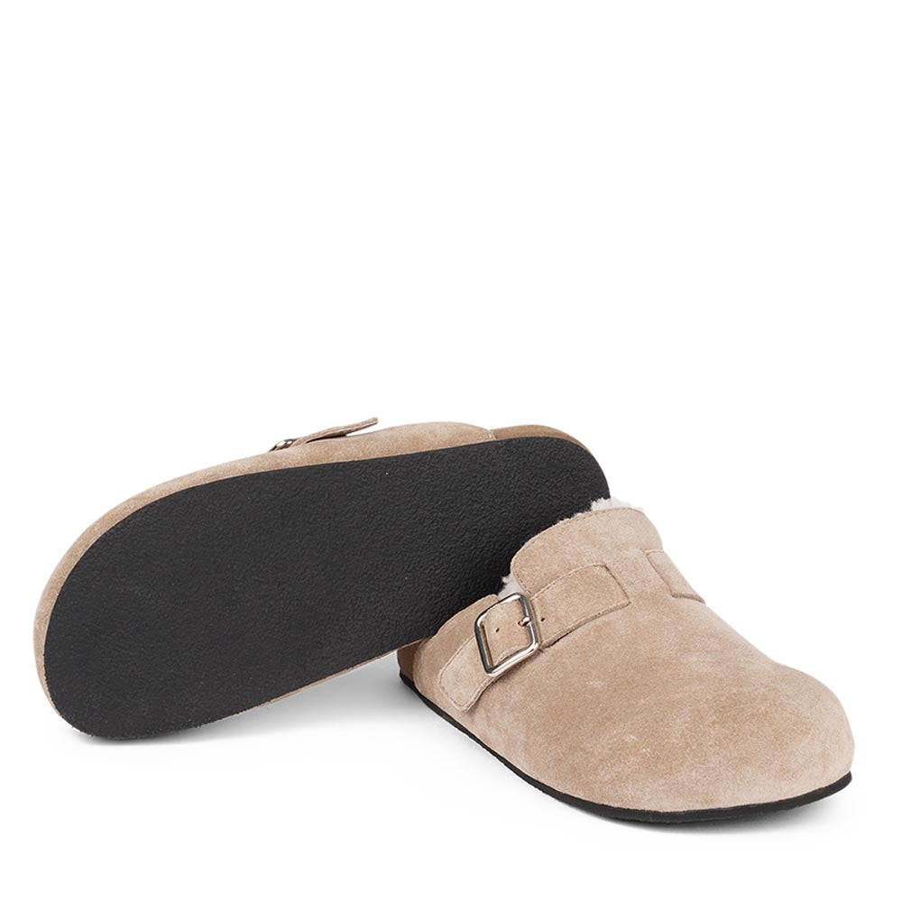 Suede Mules with adjustable buckle and curly shearling lining  Lovelies shearling mules will bring softness and warmth to your feet this summer. The combination of soft curly shearling and the durable rubber sole guarantees the utmost comfort to the wearer. Nesso Mules in Taupe from Danish Lovelies Studio.