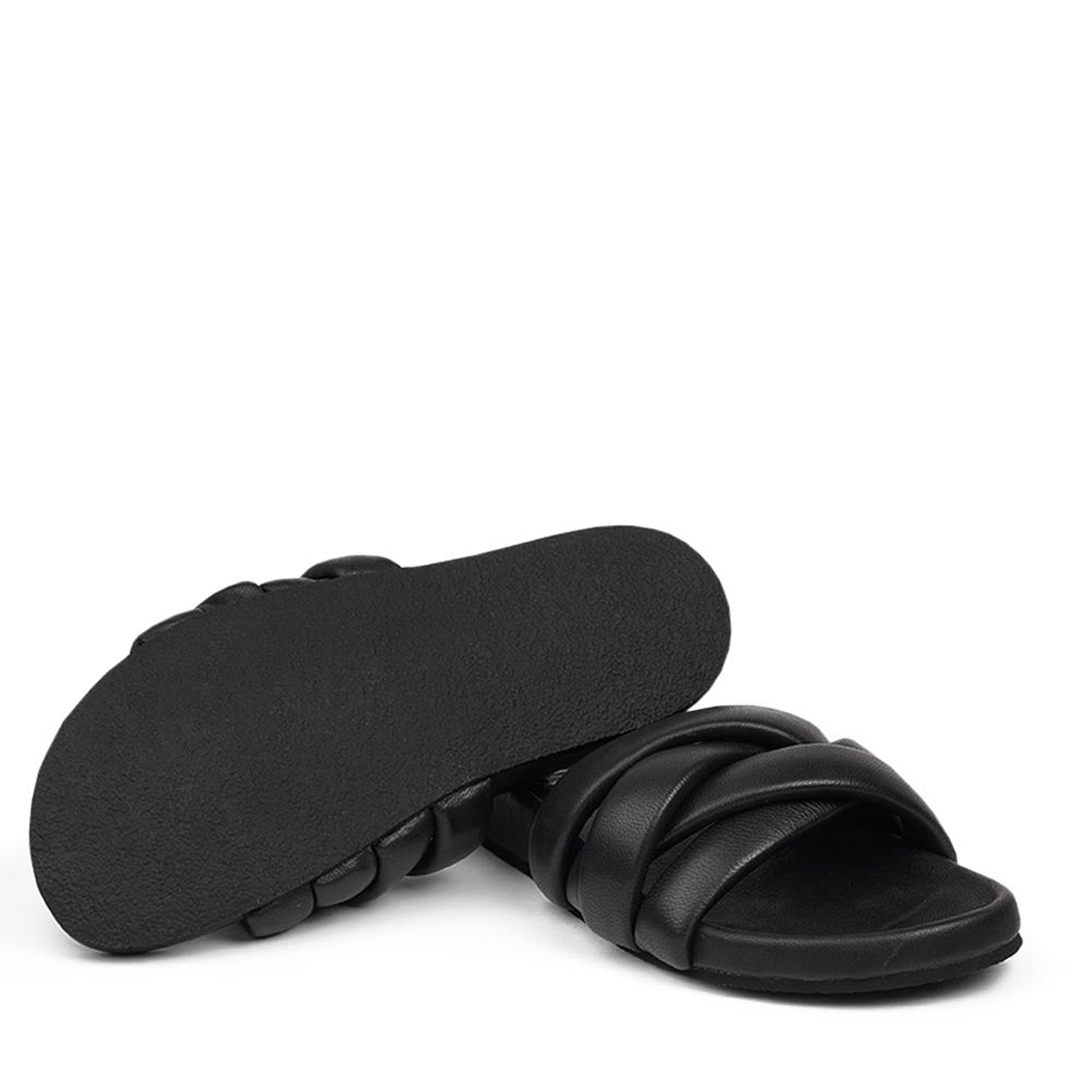 These soft nappa leather sandals come with 4 puffy leather straps for the best fit, comfort and style With its delicate and soft fabrics, you feel at ease and elegant at the same time. The easy to-go sandals will fit to your feminine dress or your summer jeans. Size and fit: True to size If you are between sizes, we recommend taking the next size up. See our Size Guide Material: Outsole / Insole : Rubber Footbed: Nappa leather Lining: Nappa leather Upper: Nappa leather