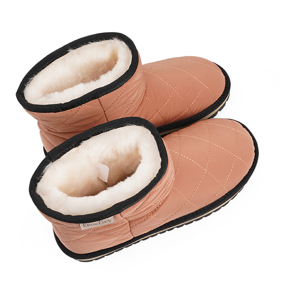 Lovelies Studio Nylon ankle boots with shearling lining. The shearling lining bring softness and warmth to your feet this autumn. With soft and durable rubber soles plus a gorgeous design you're perfectly suited for the wintertime. The Quilted nylon is water resistant and all shearling is from Australia. Outsole / Insole : Rubber 3 cm high Footbed: Shearling Lining: Shearling Upper: Quilted nylon LWG Environmental GOLD RATED Certification