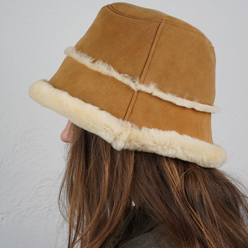 Lovelies Studio -  danish design - Would you like to stay warm and trendy this winter then the Semeru bucket hat could be a great add on to your wardrobe.  Material:  Made with 100% Sheepskin. This incredible material balances form with function, offering a chic look with lightweight insulation in the winter and temperature regulation when spring arrives.