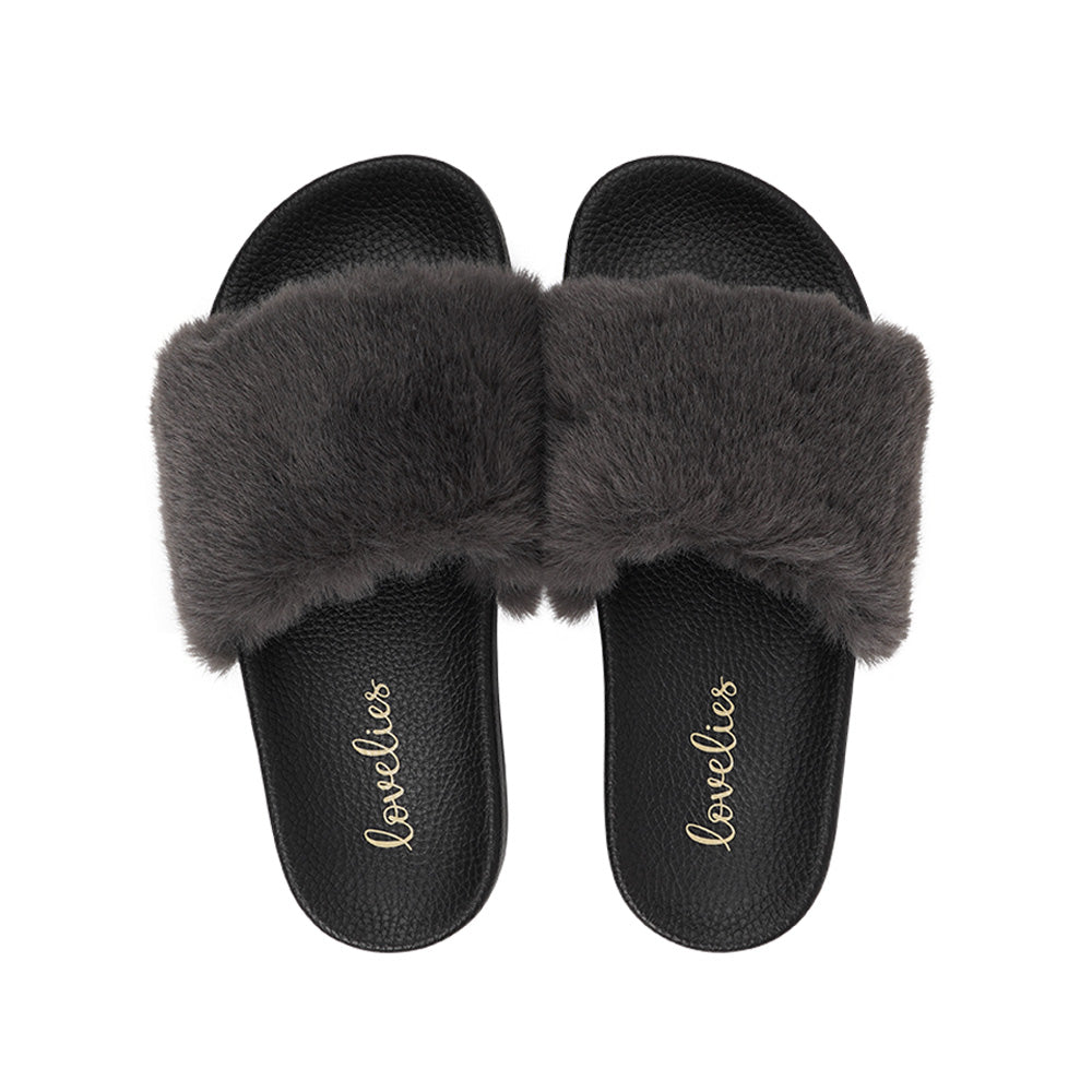 Lovelies Studio Denmark - Exclusive slides with faux fur. Beautiful and feminine faux fur slides. The soft rubber sole is light and very comfortable. We are proud member of 1% for the planet Enjoy your Lovelies Material: Sole : PU Rubber Lining: Cotton Upper: Faux fur Summer slides in black and grey
