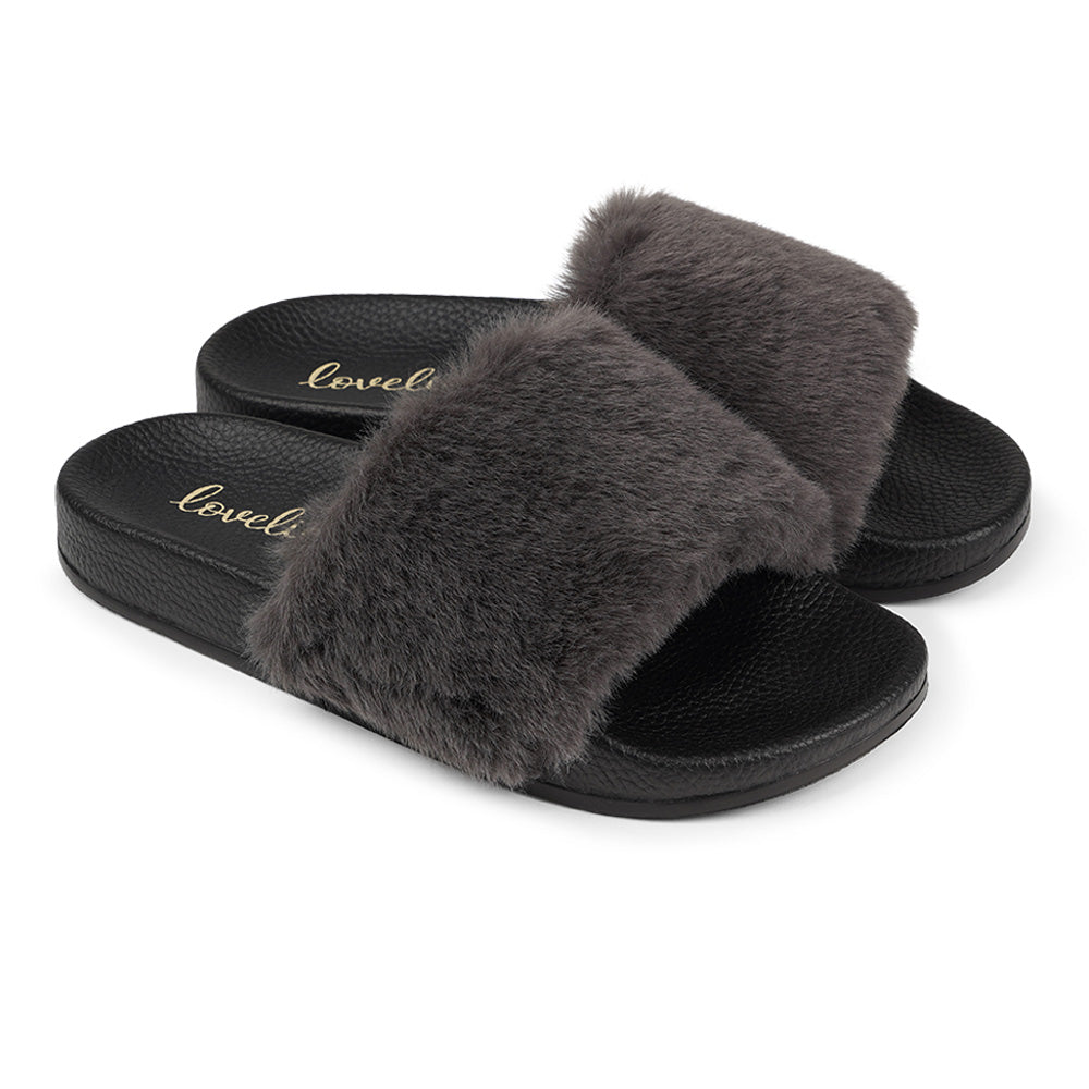 Lovelies Studio Denmark -  Exclusive slides with faux fur. Beautiful and feminine faux fur slides.  The soft rubber sole is light and very comfortable.   We are proud member of 1% for the planet  Enjoy your Lovelies  Material:  Sole : PU   Rubber Lining: Cotton Upper: Faux fur Summer slides in black and grey