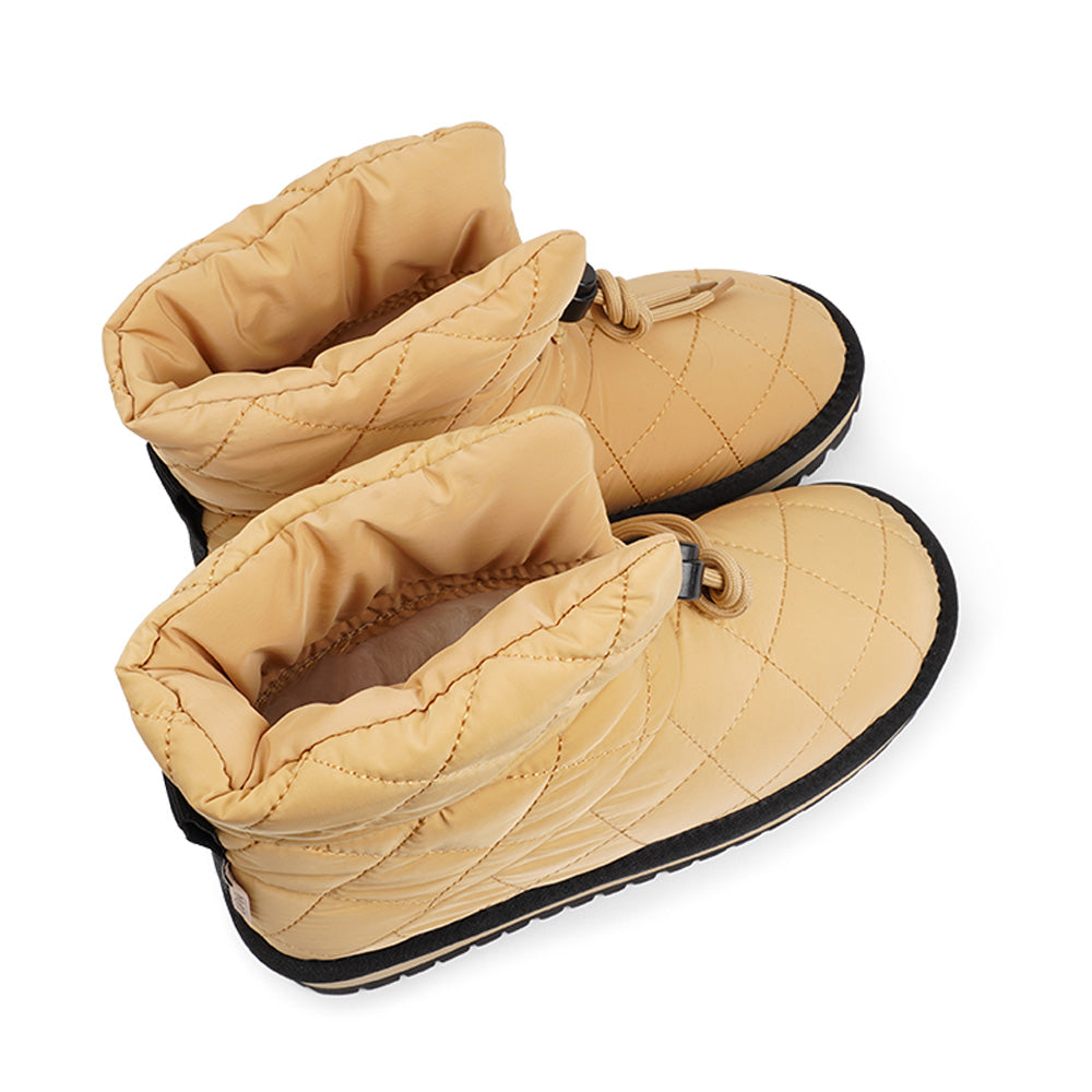 Lovelies Studio Nylon ankle boots with shearling lining. The shearling lining bring softness and warmth to your feet this autumn. With soft and durable rubber soles plus a gorgeous design you're perfectly suited for the wintertime. The Quilted nylon is water resistant and all shearling is from Australia. Outsole / Insole : Rubber 3 cm high Footbed: Shearling Lining: Shearling Upper: Quilted nylon LWG Environmental GOLD RATED Certification