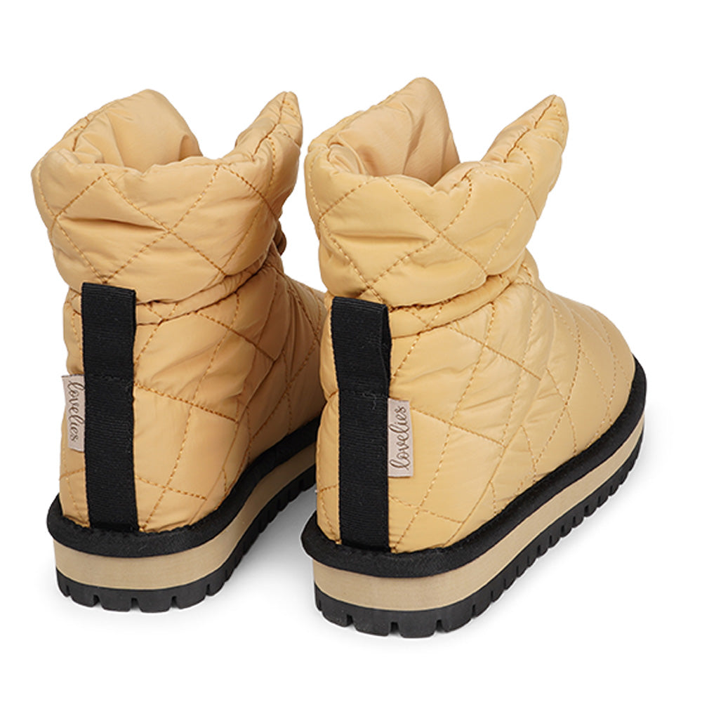 Lovelies Studio Nylon ankle boots with shearling lining. The shearling lining bring softness and warmth to your feet this autumn. With soft and durable rubber soles plus a gorgeous design you're perfectly suited for the wintertime. The Quilted nylon is water resistant and all shearling is from Australia. Outsole / Insole : Rubber 3 cm high Footbed: Shearling Lining: Shearling Upper: Quilted nylon LWG Environmental GOLD RATED Certification