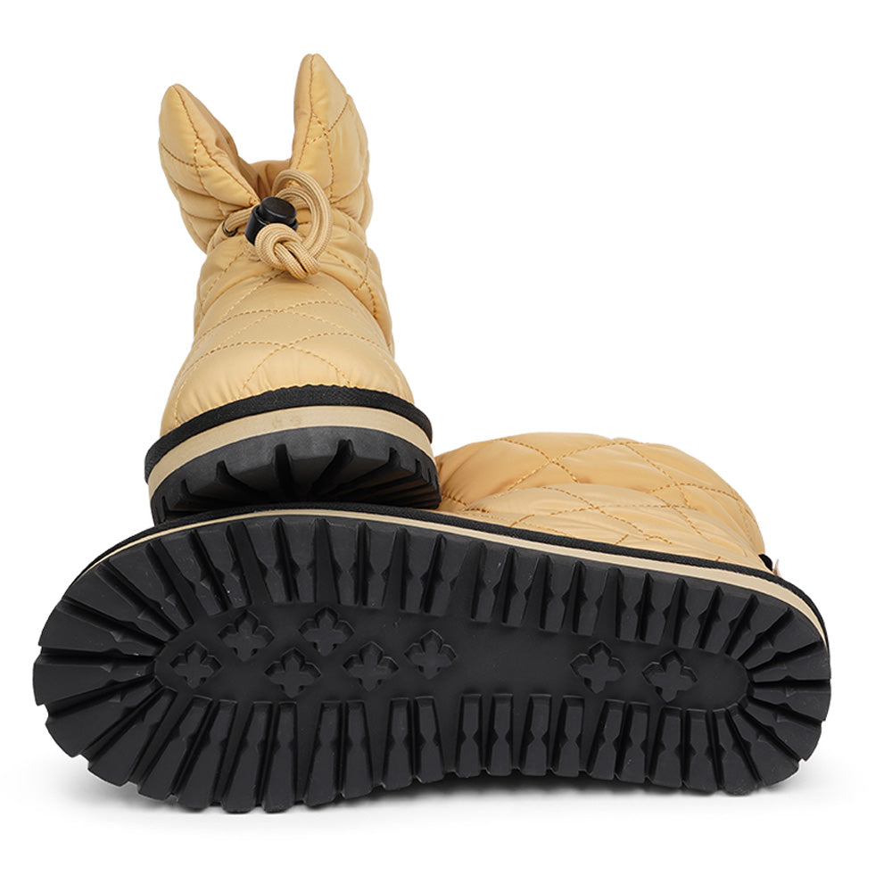 Lovelies Studio Nylon ankle boots with shearling lining. The shearling lining bring softness and warmth to your feet this autumn. With soft and durable rubber soles plus a gorgeous design you're perfectly suited for the wintertime. The Quilted nylon is water resistant and all shearling is from Australia. Outsole / Insole : Rubber 3 cm high Footbed: Shearling Lining: Shearling Upper: Quilted nylon LWG Environmental GOLD RATED Certification