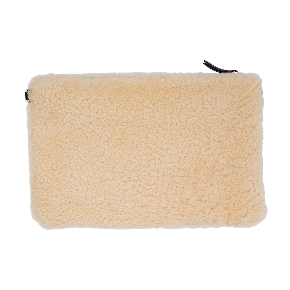 Lovelies Studio Wujii is a large shearling clutch which has room enough for your Ipad and notebooks . Wujii is hand made from the finest curly shearling from Australia.  Top zipped closing   Detachable wrist strap   Satin lining and flat zipped inner pocket   Item comes with a branded dust bag.   Embossed Lovelies logo on the front   Gold-toned hardware   Measurements W34 X D2 X H22 cm   100 % Australian curly shearling