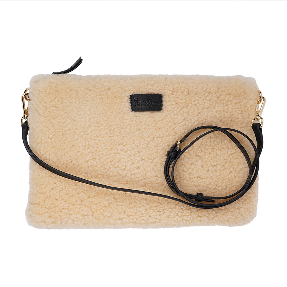 Lovelies Studio Wujii is a large shearling clutch which has room enough for your Ipad and notebooks . Wujii is hand made from the finest curly shearling from Australia.  Top zipped closing   Detachable wrist strap   Satin lining and flat zipped inner pocket   Item comes with a branded dust bag.   Embossed Lovelies logo on the front   Gold-toned hardware   Measurements W34 X D2 X H22 cm   100 % Australian curly shearling