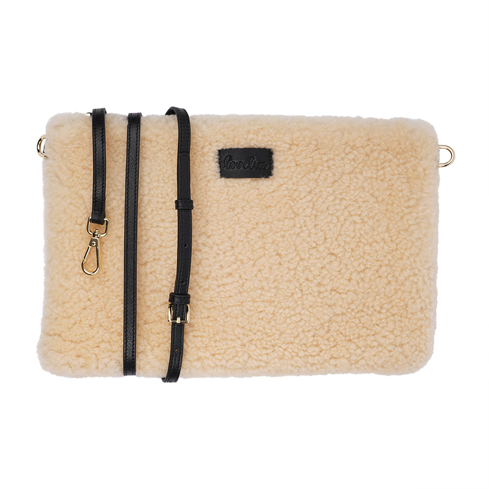 Lovelies Studio Wujii is a large shearling clutch which has room enough for your Ipad and notebooks . Wujii is hand made from the finest curly shearling from Australia.  Top zipped closing   Detachable wrist strap   Satin lining and flat zipped inner pocket   Item comes with a branded dust bag.   Embossed Lovelies logo on the front   Gold-toned hardware   Measurements W34 X D2 X H22 cm   100 % Australian curly shearling