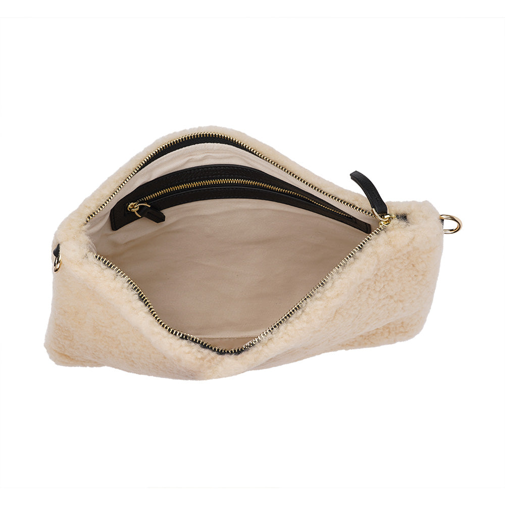 Lovelies Studio Wujii is a large shearling clutch which has room enough for your Ipad and notebooks . Wujii is hand made from the finest curly shearling from Australia.  Top zipped closing   Detachable wrist strap   Satin lining and flat zipped inner pocket   Item comes with a branded dust bag.   Embossed Lovelies logo on the front   Gold-toned hardware   Measurements W34 X D2 X H22 cm   100 % Australian curly shearling