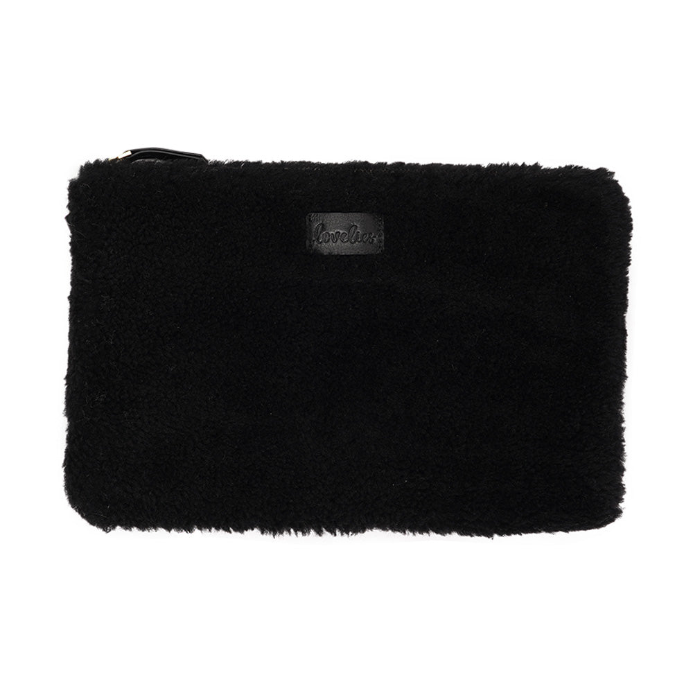 Lovelies Studio Wujii is a large shearling clutch which has room enough for your Ipad and notebooks . Wujii is hand made from the finest curly shearling from Australia.  Top zipped closing   Detachable wrist strap   Satin lining and flat zipped inner pocket   Item comes with a branded dust bag.   Embossed Lovelies logo on the front   Gold-toned hardware   Measurements W34 X D2 X H22 cm   100 % Australian curly shearling 