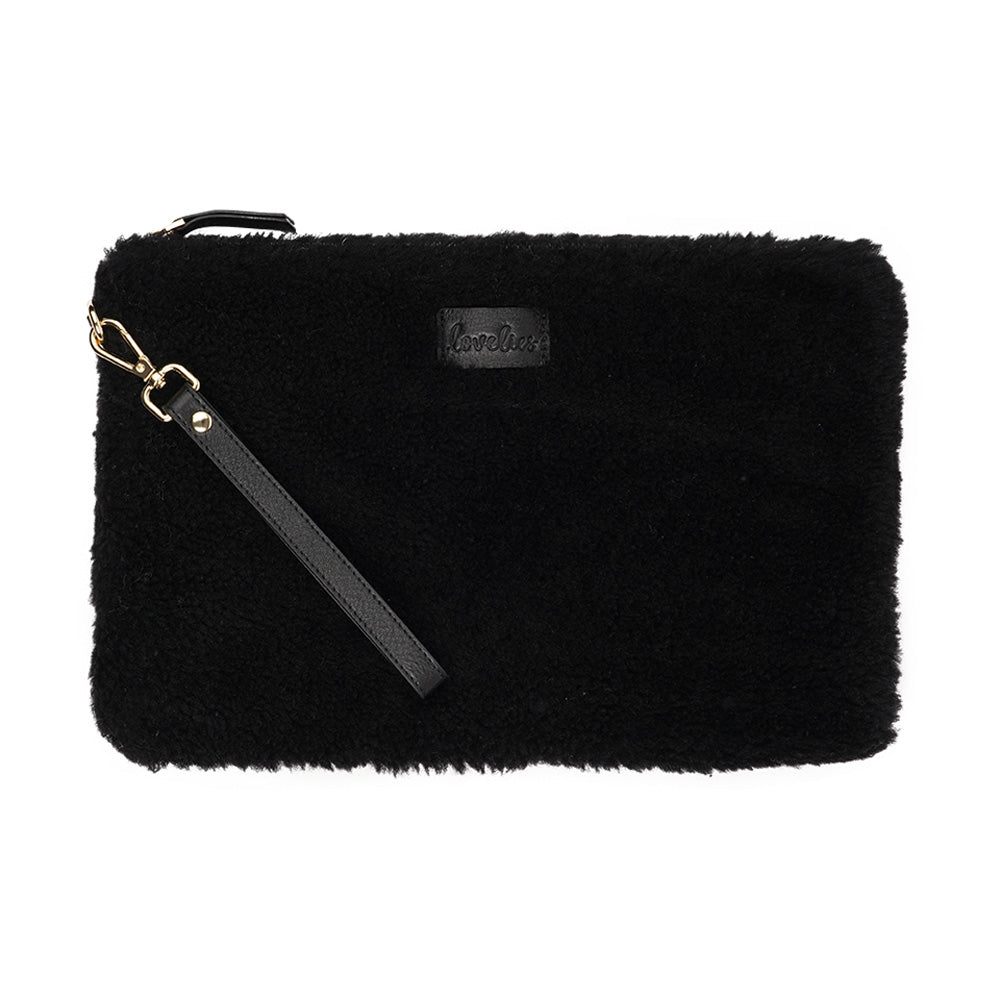 Lovelies Studio Wujii is a large shearling clutch which has room enough for your Ipad and notebooks . Wujii is hand made from the finest curly shearling from Australia.  Top zipped closing   Detachable wrist strap   Satin lining and flat zipped inner pocket   Item comes with a branded dust bag.   Embossed Lovelies logo on the front   Gold-toned hardware   Measurements W34 X D2 X H22 cm   100 % Australian curly shearling 