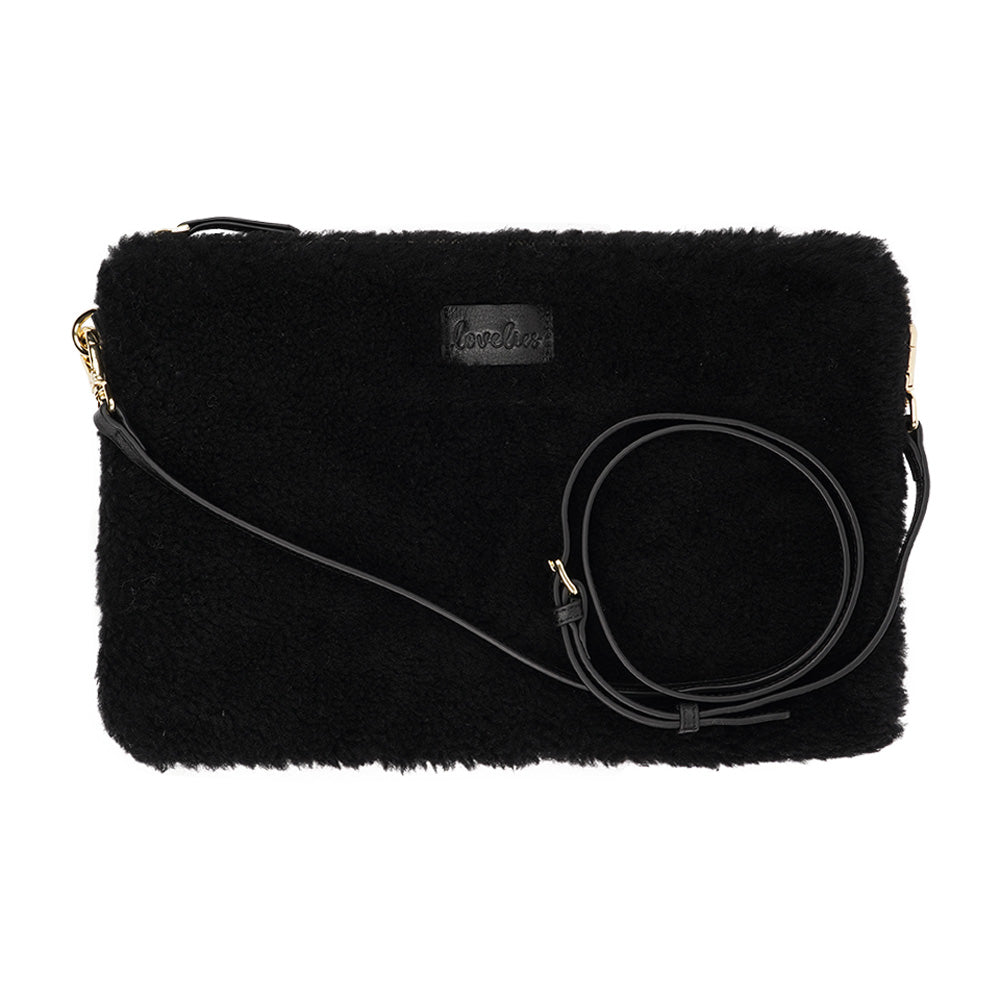 Lovelies Studio Wujii is a large shearling clutch which has room enough for your Ipad and notebooks . Wujii is hand made from the finest curly shearling from Australia. Top zipped closing Detachable wrist strap Satin lining and flat zipped inner pocket Item comes with a branded dust bag. Embossed Lovelies logo on the front Gold-toned hardware Measurements W34 X D2 X H22 cm 100 % Australian curly shearling