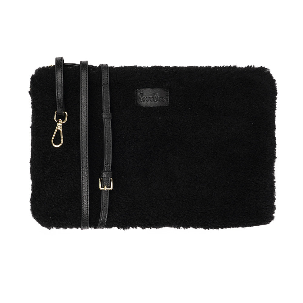Lovelies Studio Wujii is a large shearling clutch which has room enough for your Ipad and notebooks . Wujii is hand made from the finest curly shearling from Australia. Top zipped closing Detachable wrist strap Satin lining and flat zipped inner pocket Item comes with a branded dust bag. Embossed Lovelies logo on the front Gold-toned hardware Measurements W34 X D2 X H22 cm 100 % Australian curly shearling