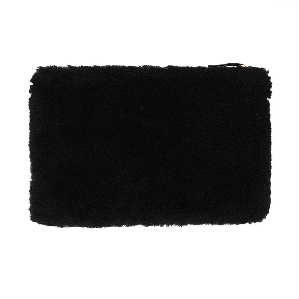 Lovelies Studio Wujii is a large shearling clutch which has room enough for your Ipad and notebooks . Wujii is hand made from the finest curly shearling from Australia. Top zipped closing Detachable wrist strap Satin lining and flat zipped inner pocket Item comes with a branded dust bag. Embossed Lovelies logo on the front Gold-toned hardware Measurements W34 X D2 X H22 cm 100 % Australian curly shearling