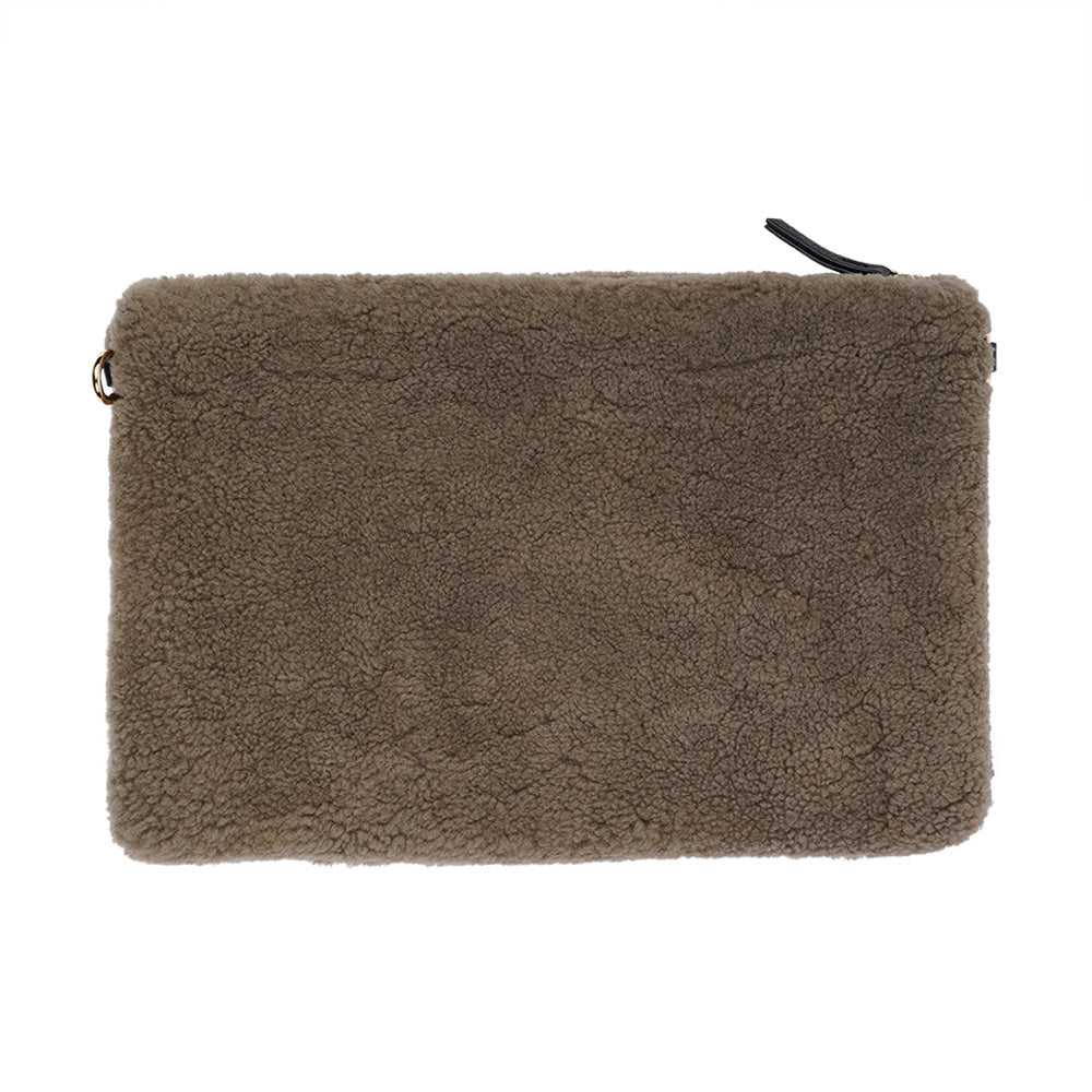 Lovelies Studio Wujii is a large shearling clutch which has room enough for your Ipad and notebooks . Wujii is hand made from the finest curly shearling from Australia.  Top zipped closing   Detachable wrist strap   Satin lining and flat zipped inner pocket   Item comes with a branded dust bag.   Embossed Lovelies logo on the front   Gold-toned hardware   Measurements W34 X D2 X H22 cm   100 % Australian curly shearling