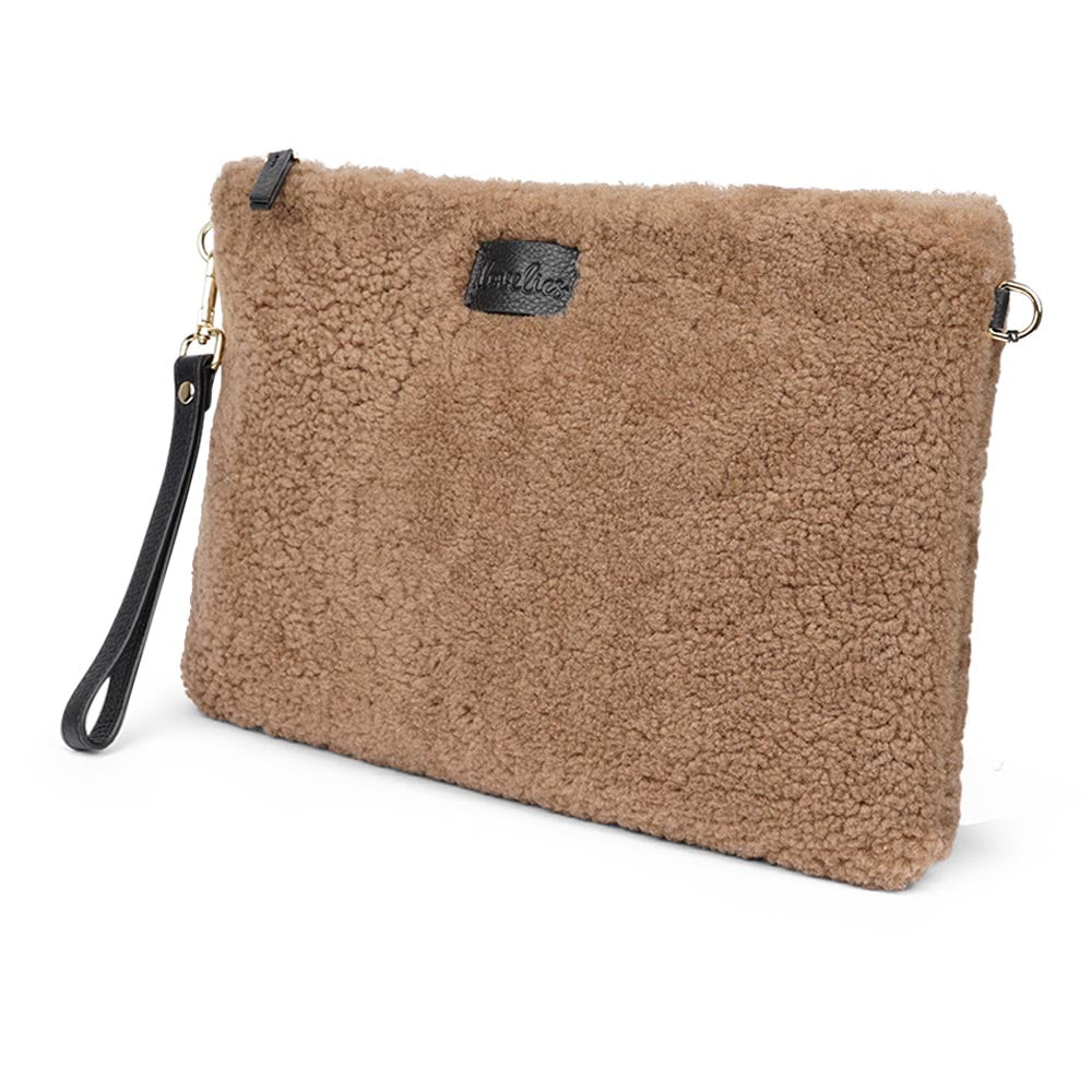 Lovelies Studio Wujii is a large shearling clutch which has room enough for your Ipad and notebooks . Wujii is hand made from the finest curly shearling from Australia.  Top zipped closing   Detachable wrist strap   Satin lining and flat zipped inner pocket   Item comes with a branded dust bag.   Embossed Lovelies logo on the front   Gold-toned hardware   Measurements W34 X D2 X H22 cm   100 % Australian curly shearling 