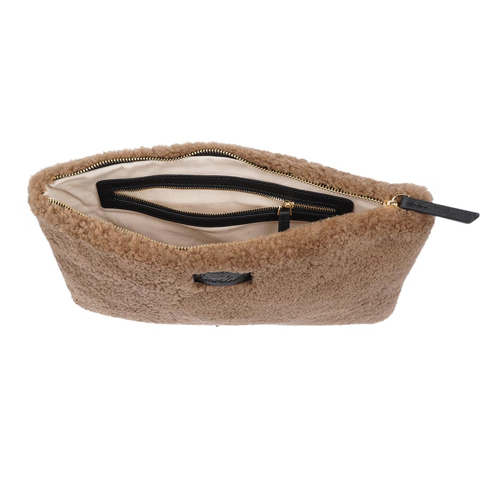 Lovelies Studio Wujii is a large shearling clutch which has room enough for your Ipad and notebooks . Wujii is hand made from the finest curly shearling from Australia. Top zipped closing Detachable wrist strap Satin lining and flat zipped inner pocket Item comes with a branded dust bag. Embossed Lovelies logo on the front Gold-toned hardware Measurements W34 X D2 X H22 cm 100 % Australian curly shearling