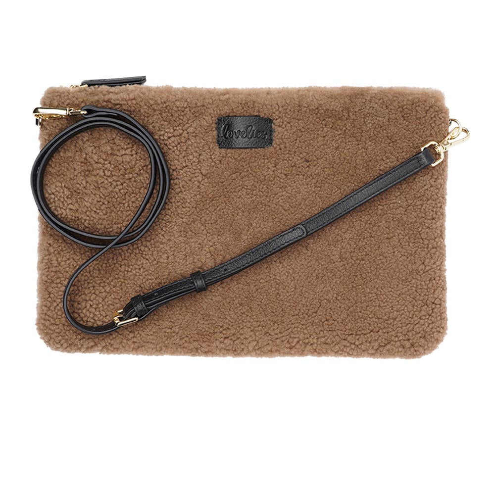 Lovelies Studio Wujii is a large shearling clutch which has room enough for your Ipad and notebooks . Wujii is hand made from the finest curly shearling from Australia. Top zipped closing Detachable wrist strap Satin lining and flat zipped inner pocket Item comes with a branded dust bag. Embossed Lovelies logo on the front Gold-toned hardware Measurements W34 X D2 X H22 cm 100 % Australian curly shearling