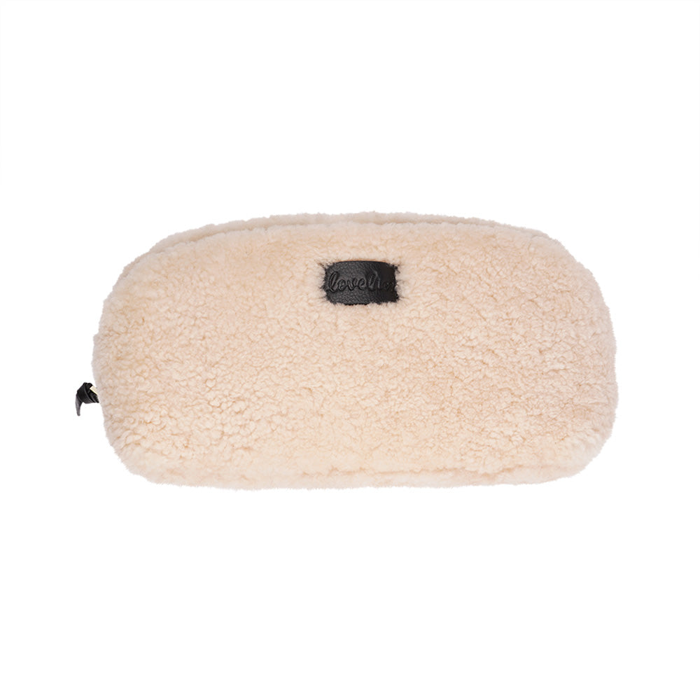 Lovelies Studio - Yadong is a beautiful shearling handbag which is perfect for carrying your essentials with you. Use Yadong as a casual clutch or an exclusive beauty bag for travelling. Top zipped closure. Cream satin lining. Item comes with a branded dust bag. Embossed Lovelies logo on the front. Gold-toned hardware. Measurements W25 X D10 X H13 cm 100 % Australian curly shearling.