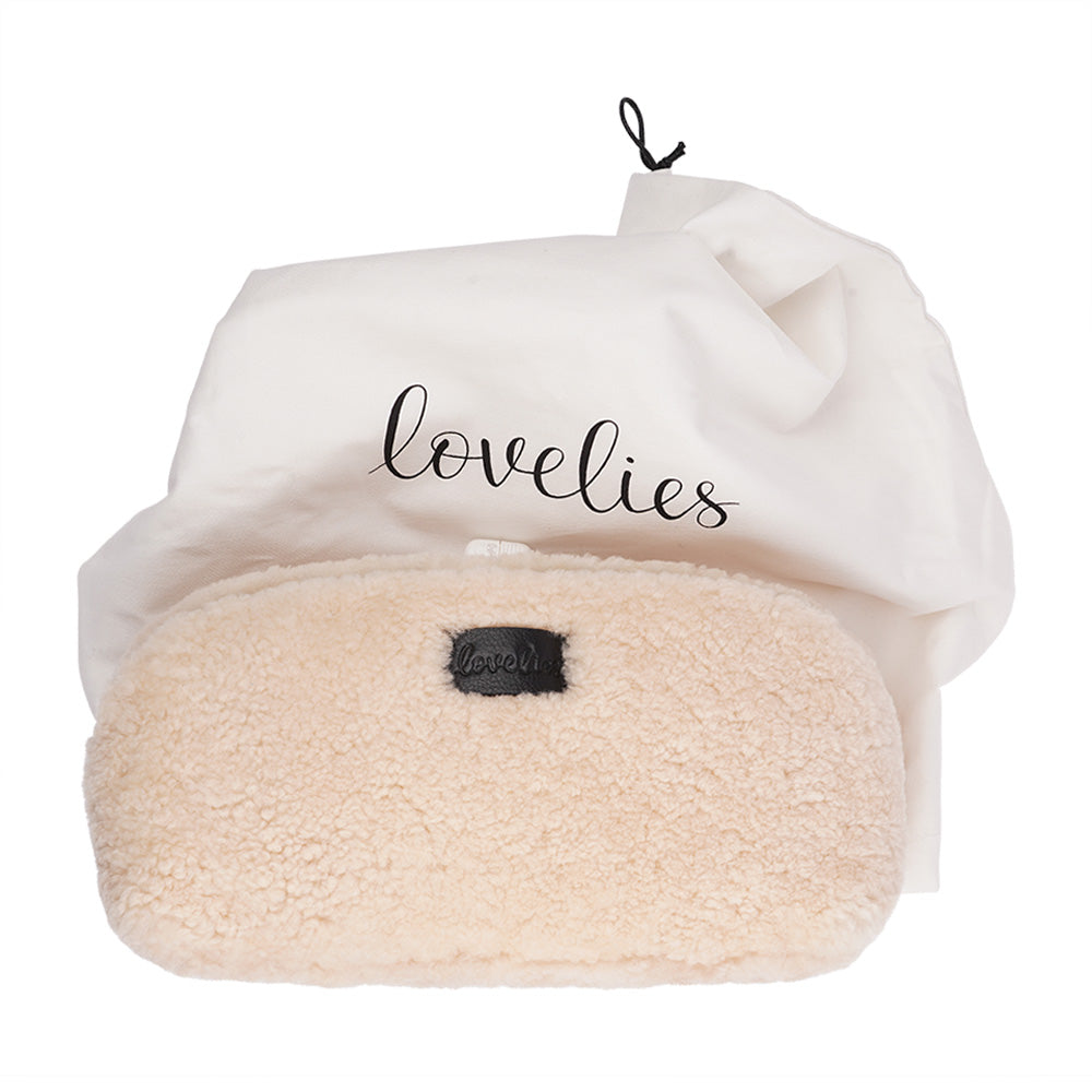 Lovelies Studio - Yadong is a beautiful shearling handbag which is perfect for carrying your essentials with you. Use Yadong as a casual clutch or an exclusive beauty bag for travelling. Top zipped closure. Cream satin lining. Item comes with a branded dust bag. Embossed Lovelies logo on the front. Gold-toned hardware. Measurements W25 X D10 X H13 cm 100 % Australian curly shearling.