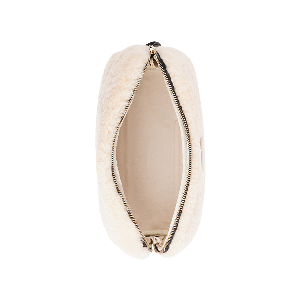 Lovelies Studio - Yadong is a beautiful shearling handbag which is perfect for carrying your essentials with you. Use Yadong as a casual clutch or an exclusive beauty bag for travelling. Top zipped closure. Cream satin lining. Item comes with a branded dust bag. Embossed Lovelies logo on the front. Gold-toned hardware. Measurements W25 X D10 X H13 cm 100 % Australian curly shearling.