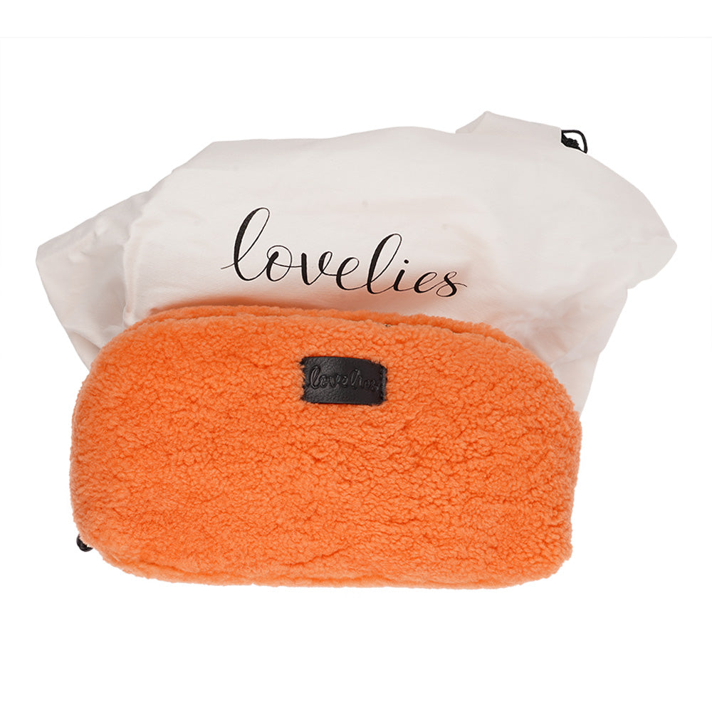 Lovelies Studio - Yadong is a beautiful shearling handbag which is perfect for carrying your essentials with you. Use Yadong as a casual clutch or an exclusive beauty bag for travelling. Top zipped closure. Cream satin lining. Item comes with a branded dust bag. Embossed Lovelies logo on the front. Gold-toned hardware. Measurements W25 X D10 X H13 cm 100 % Australian curly shearling.